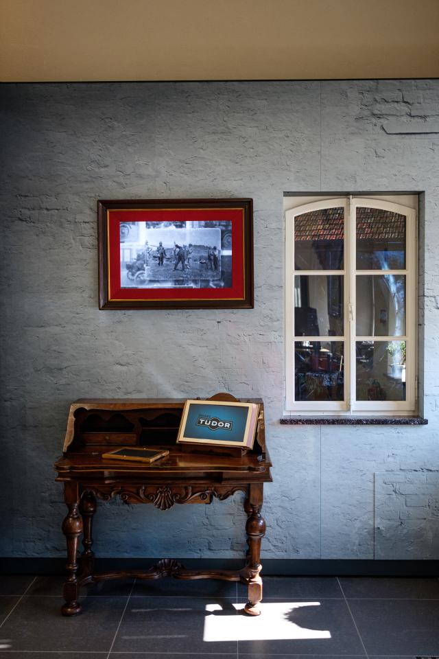 Room at the Tudor Museum with a window and an old secretary desk.