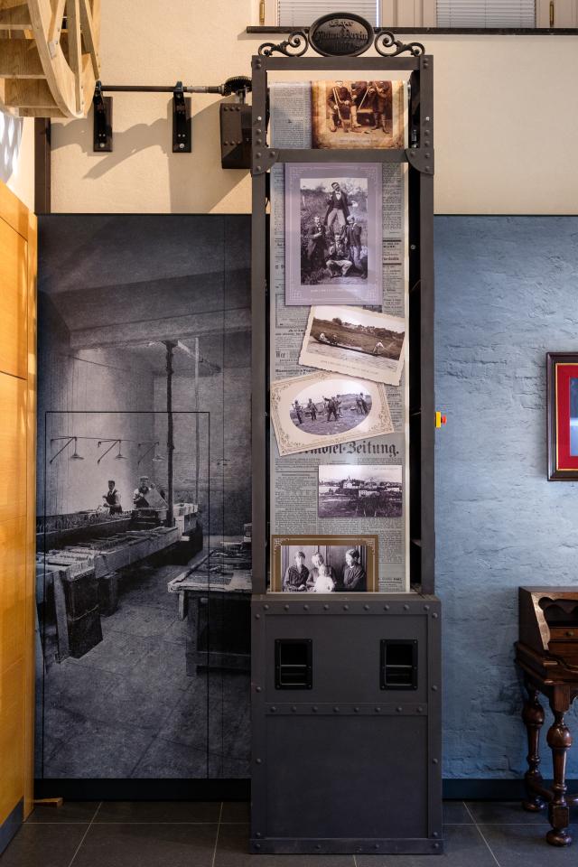 Room at the Tudor Museum with archival photos