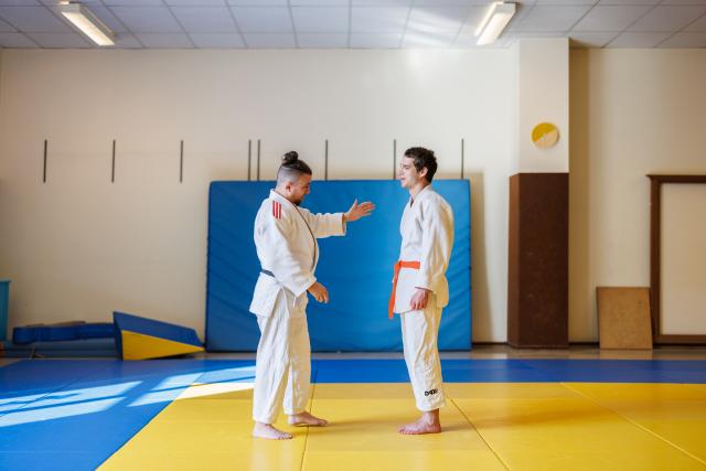 Two men practicing Para Judo in a dojo