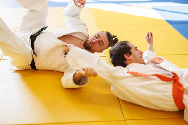 Two men practicing Para Judo in a dojo